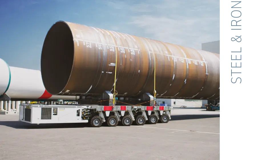  A tower of a dismantled wind turbine is transported on an articulated lorry
