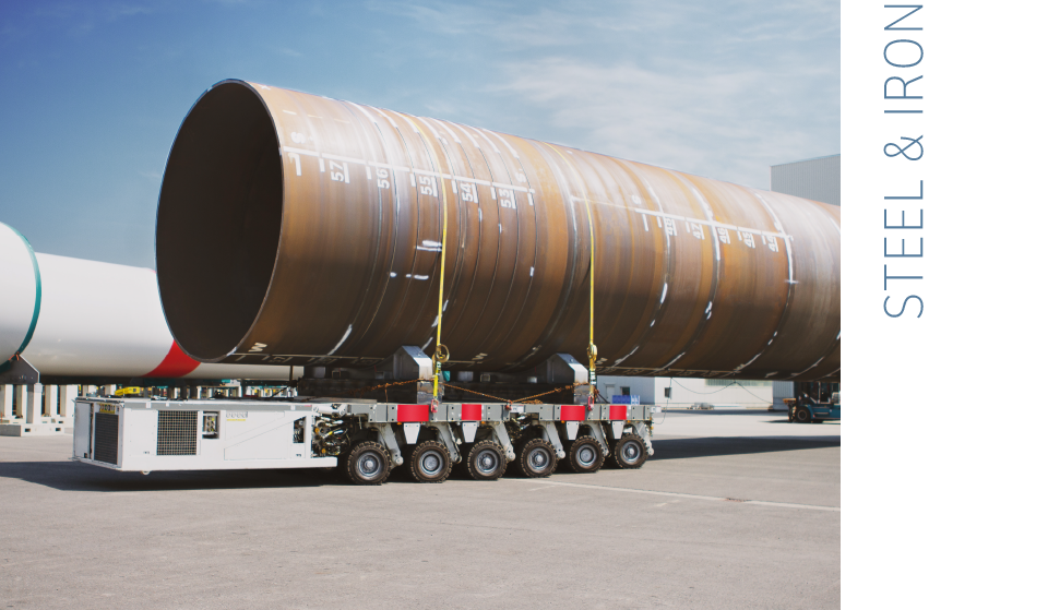  A tower of a dismantled wind turbine is transported on an articulated lorry